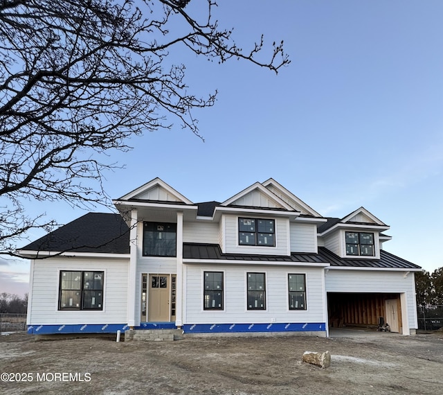 modern farmhouse style home featuring a garage