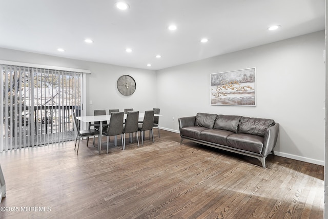 dining room with wood-type flooring