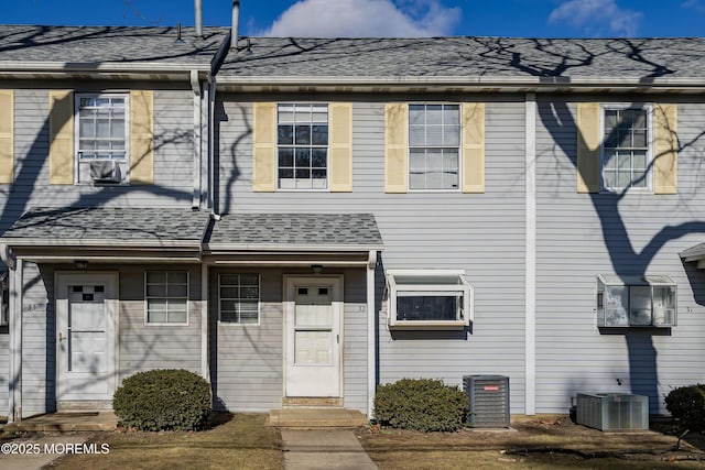 townhome / multi-family property with cooling unit and central AC