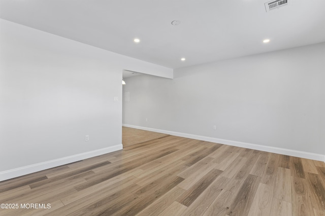 spare room featuring light hardwood / wood-style floors