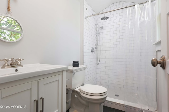 bathroom with walk in shower, vaulted ceiling, vanity, and toilet