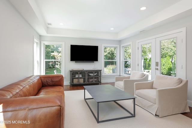 living room with french doors and hardwood / wood-style flooring