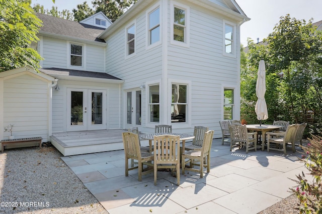 back of property with french doors and a patio area