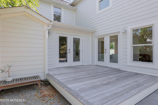 wooden deck featuring french doors