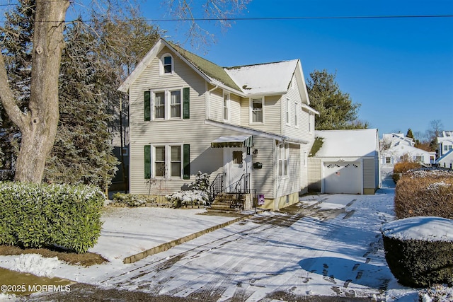 view of front property with a garage and an outdoor structure