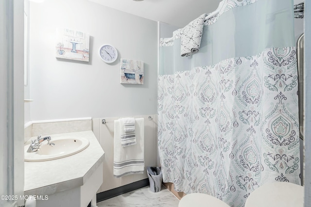 bathroom with toilet and vanity