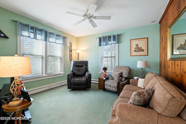 living room with ceiling fan, carpet, and a baseboard heating unit