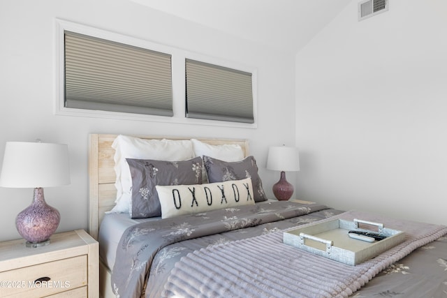 bedroom with vaulted ceiling