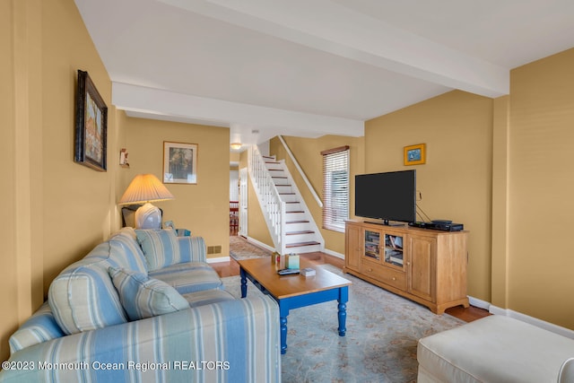 living room with hardwood / wood-style flooring and beamed ceiling