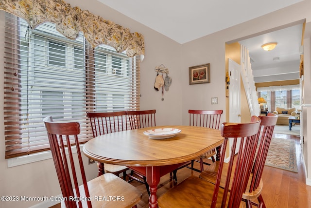 dining space featuring hardwood / wood-style flooring