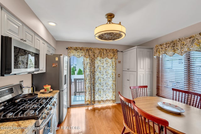 dining space featuring light hardwood / wood-style floors