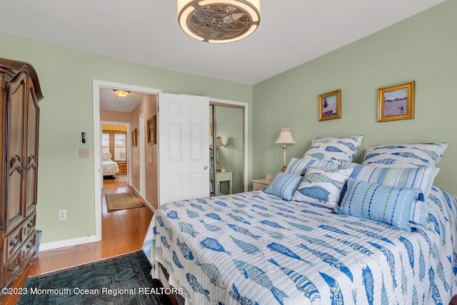 bedroom with wood-type flooring