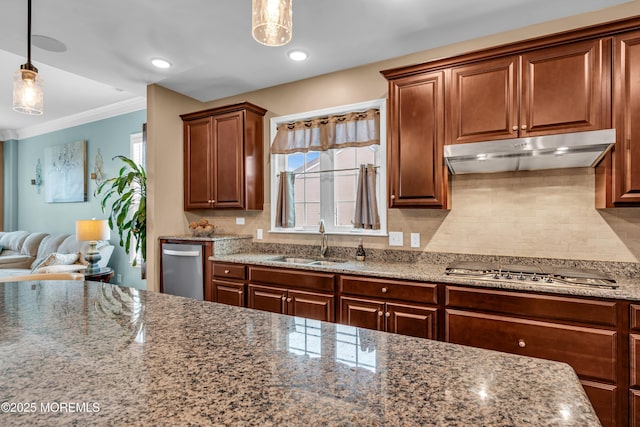 kitchen with sink, hanging light fixtures, backsplash, and stainless steel gas cooktop