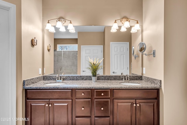 bathroom with a shower with shower door and vanity