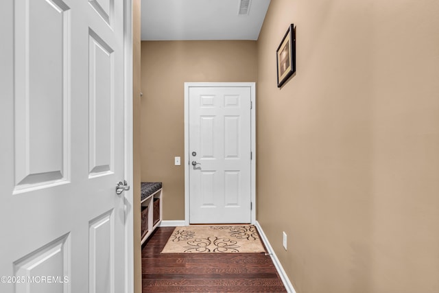 doorway to outside with dark wood-type flooring