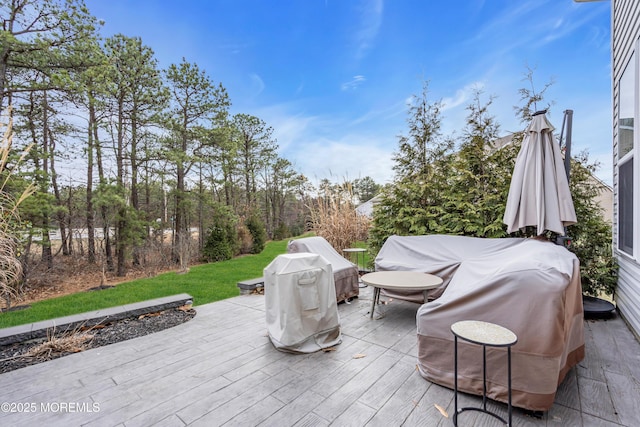 view of patio with a wooden deck and area for grilling