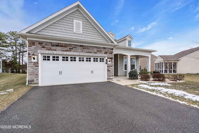 view of front of home with covered porch and a garage