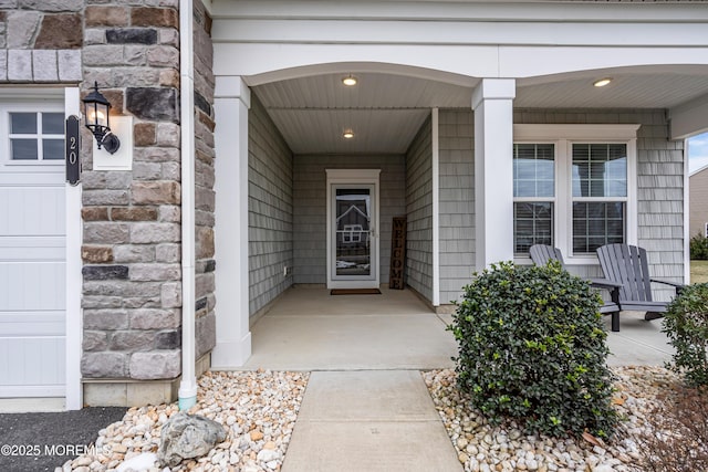 view of exterior entry featuring a porch