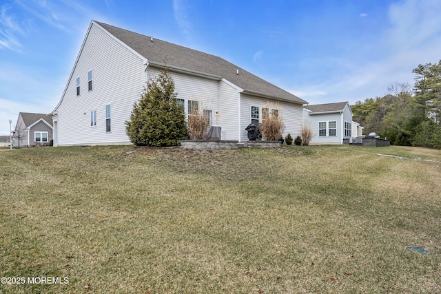 view of side of home featuring a yard