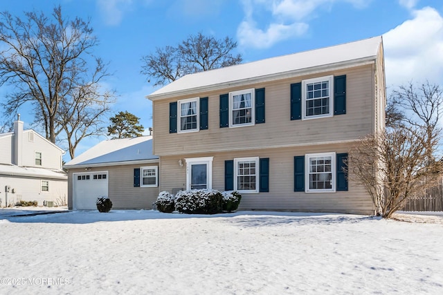 colonial inspired home with a garage