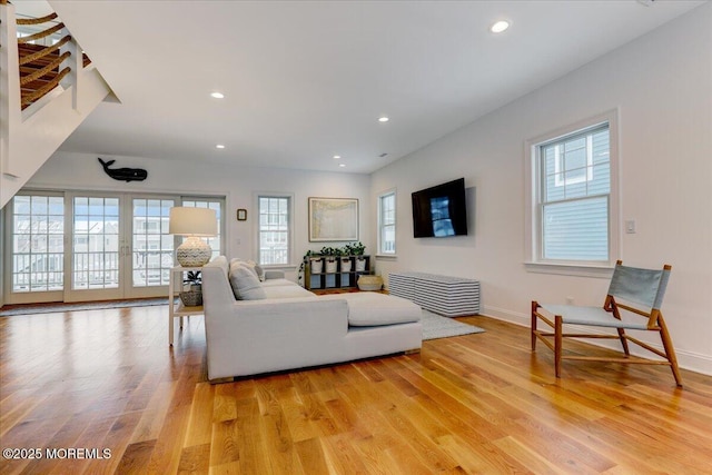 living room with light hardwood / wood-style flooring