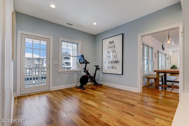 workout room with hardwood / wood-style flooring