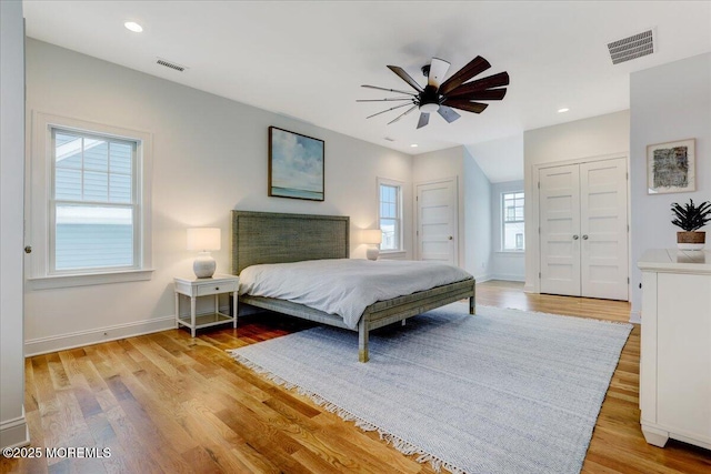 bedroom featuring a closet, ceiling fan, and light hardwood / wood-style floors