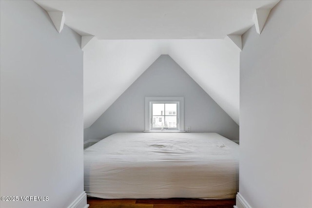 bedroom featuring vaulted ceiling