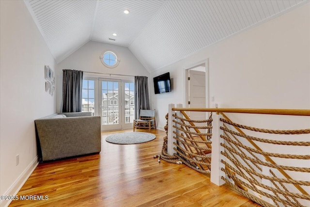 living area with lofted ceiling and wood-type flooring