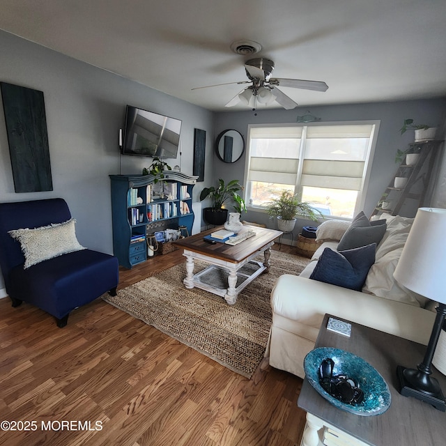 living room with ceiling fan and hardwood / wood-style floors