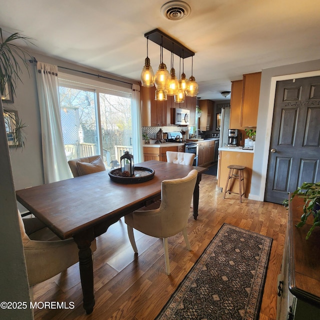 dining space featuring light hardwood / wood-style flooring