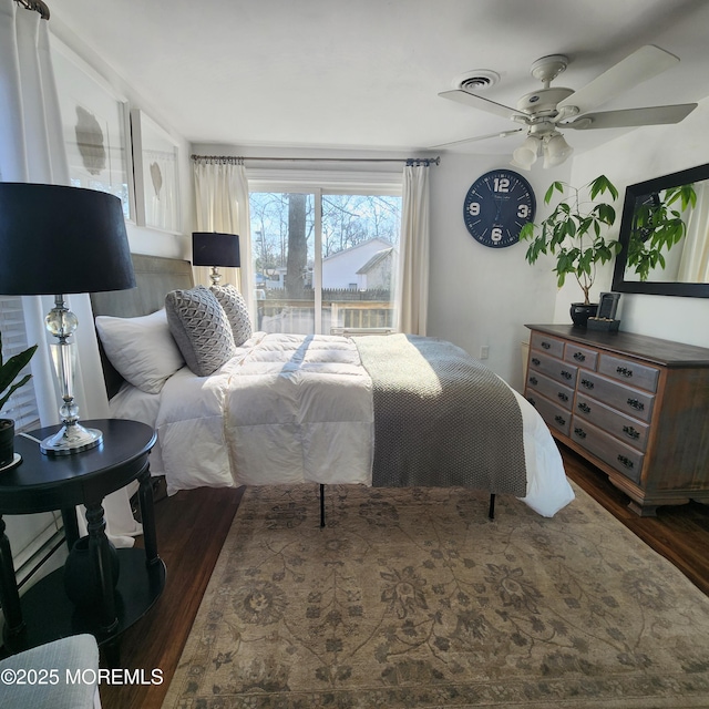 bedroom featuring ceiling fan and dark hardwood / wood-style flooring