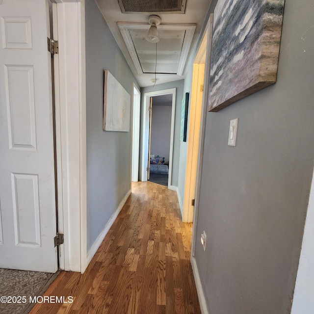 hallway with wood-type flooring