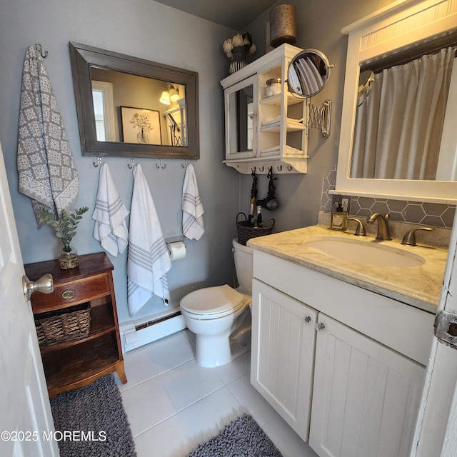 bathroom with baseboard heating, tile patterned floors, vanity, toilet, and a shower with shower curtain