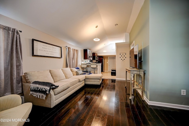 living room with lofted ceiling and dark hardwood / wood-style floors