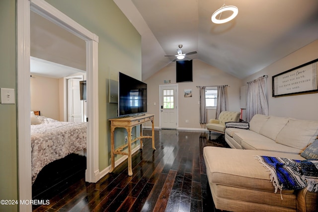 living room with ceiling fan, vaulted ceiling, and dark hardwood / wood-style flooring