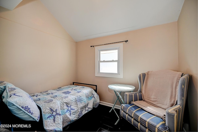 bedroom with lofted ceiling