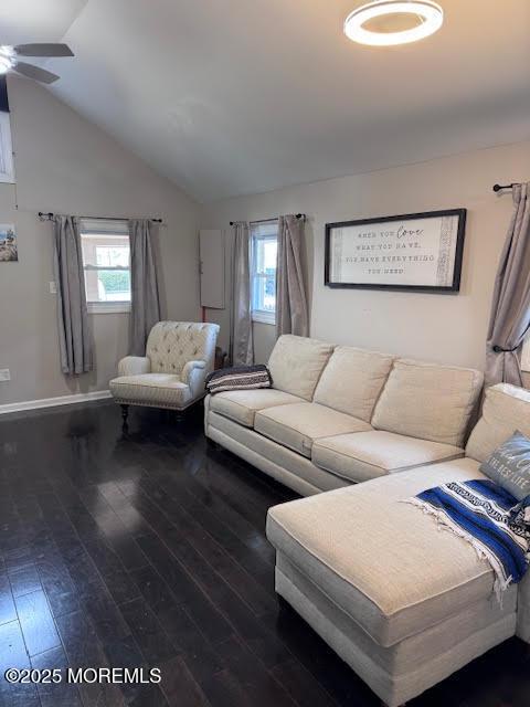 living room featuring lofted ceiling, ceiling fan, and hardwood / wood-style flooring