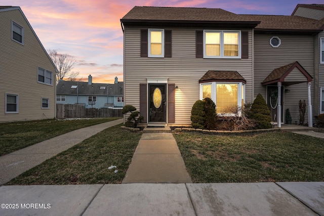 view of front of home with a lawn