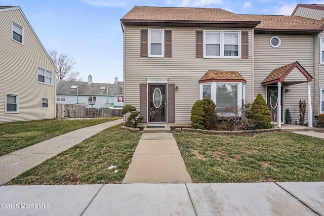 view of front of property with a front lawn