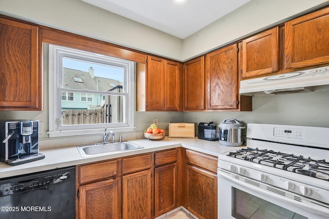 kitchen featuring white range with gas stovetop, black dishwasher, and sink