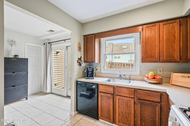 kitchen featuring sink, black dishwasher, range, and light tile patterned floors