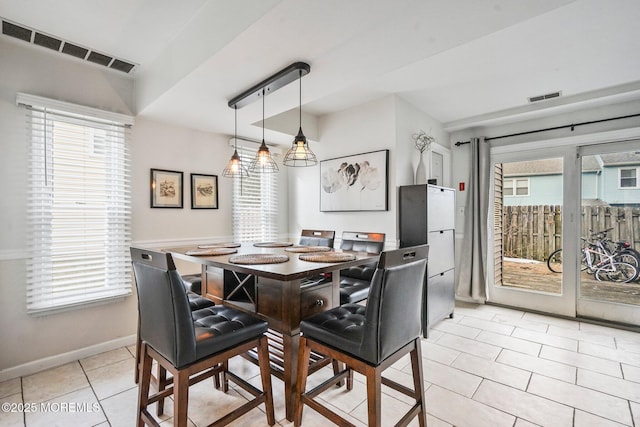 dining area featuring light tile patterned floors