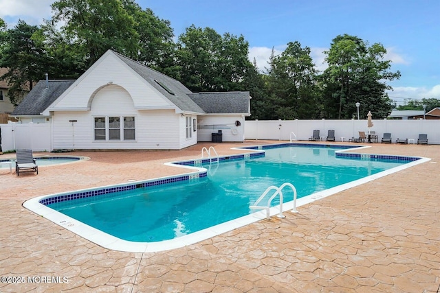 view of swimming pool featuring a patio area