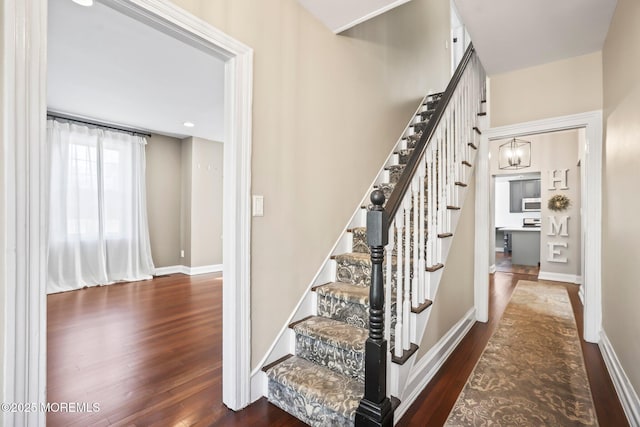 stairs with wood-type flooring