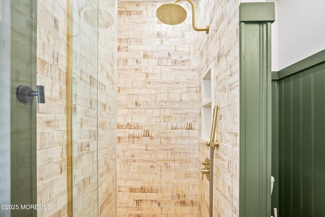 bathroom with a tile shower