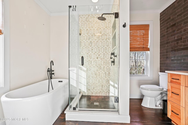 full bathroom featuring toilet, vanity, ornamental molding, hardwood / wood-style flooring, and independent shower and bath