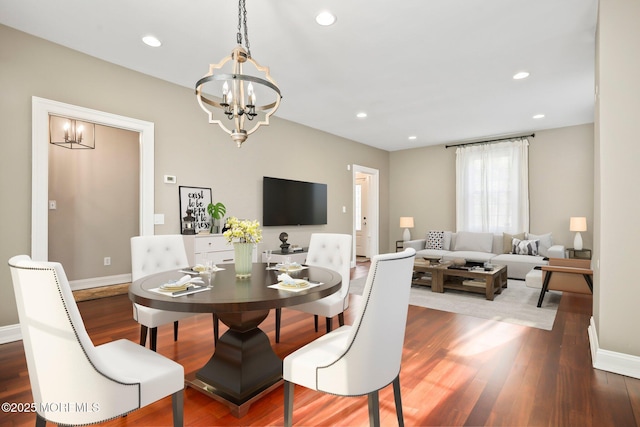 dining room with an inviting chandelier and hardwood / wood-style floors