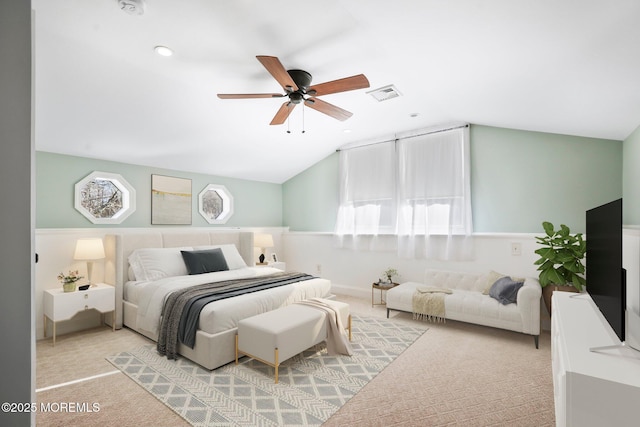 bedroom featuring light carpet, ceiling fan, and vaulted ceiling