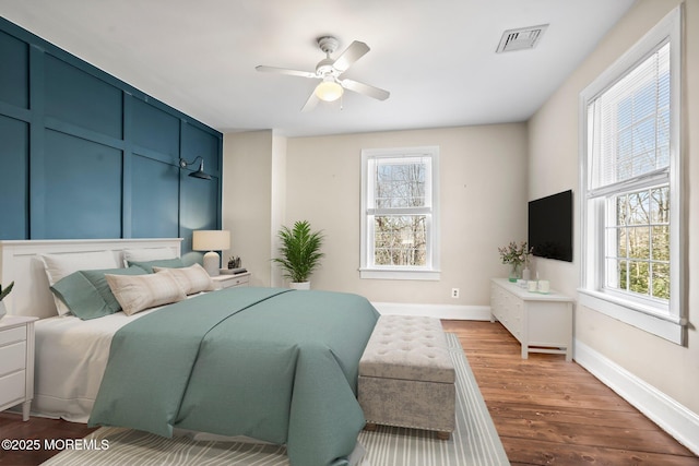 bedroom featuring wood-type flooring and ceiling fan